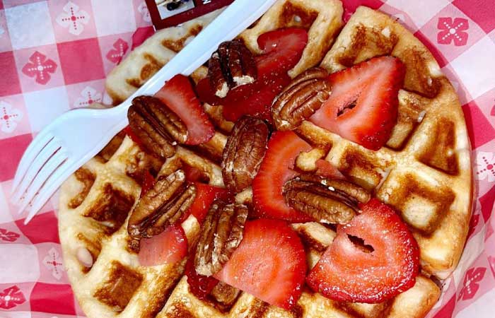 Waffle with strawberries and pecans